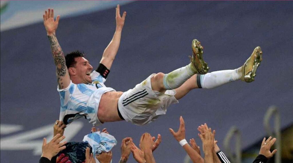 Lionel Messi is launched into the air by his Argentine